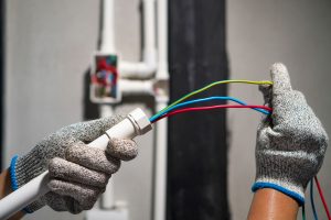 man working with conduits from a commercial electrical supplies store