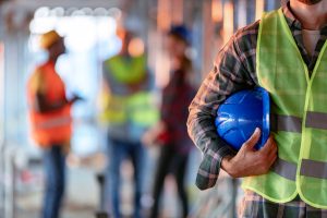 Man holding blue safety helmet from RGV Commercial Electrical Supply in McAllen