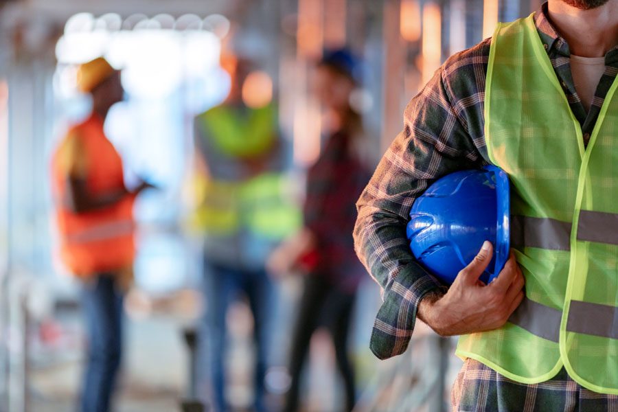 Man holding blue safety helmet from RGV Commercial Electrical Supply in McAllen